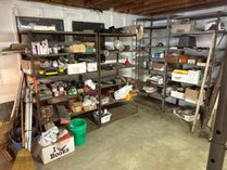 3 Metal Shelving Units With Assorted Goods