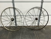 Two Antique Farm Implement Wheels