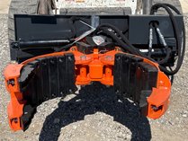 Wolverine Skid Steer Three-Claw Rock & Tree Transporting Machine
