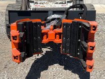 Wolverine Skid Steer Five-Claw Rock & Tree Transporting Machine