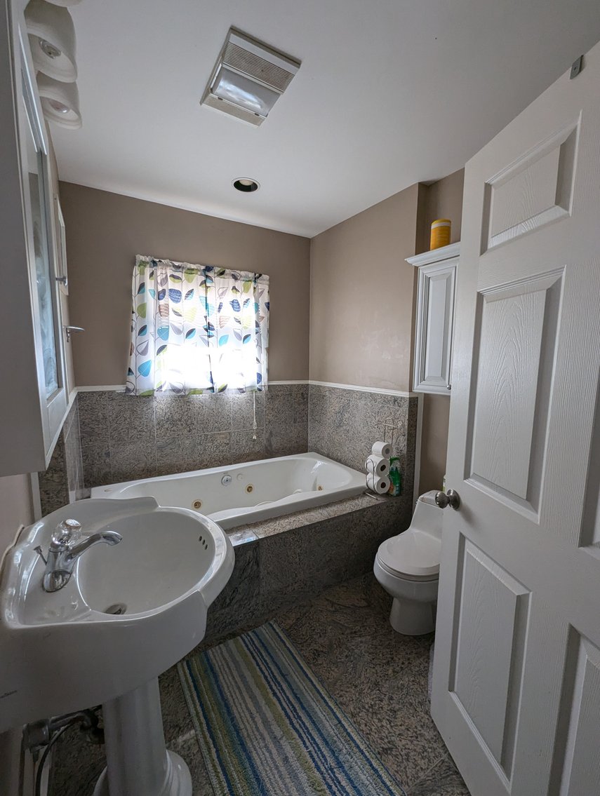 Image for 5 BR, 4 BATH WATERFRONT HOME W/ DET. 2-CAR GARAGE/ 65' +/- WATERFRONT ON LYNCH COVE W/ PIER