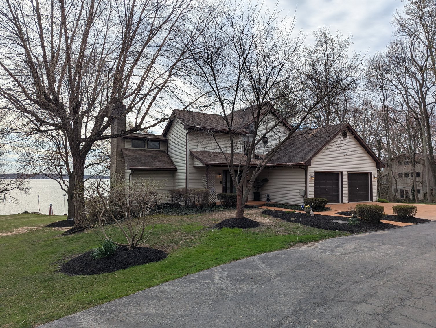 Image for LARGE WATERFRONT PROPERTY/ 2-STORY CONTEMP. HOME W/ ATT. 2-CAR GARAGE & 1-BR COTTAGE HOME/(4) PARCELS TOTALING 3.35 +/- AC SOLD IN THE ENTIRETY/ 155' FT FRONTAGE ON BUSH RIVER W SANDY BEACH/ LARGE DOCK W/ (10) +/- BOAT SLIPS, TIKI BAR & MORE!