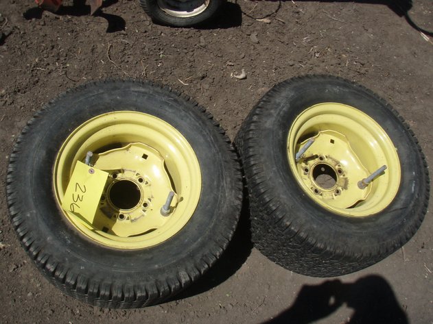 Image for John Deere 318 rear rims and tires 23x10.50x12