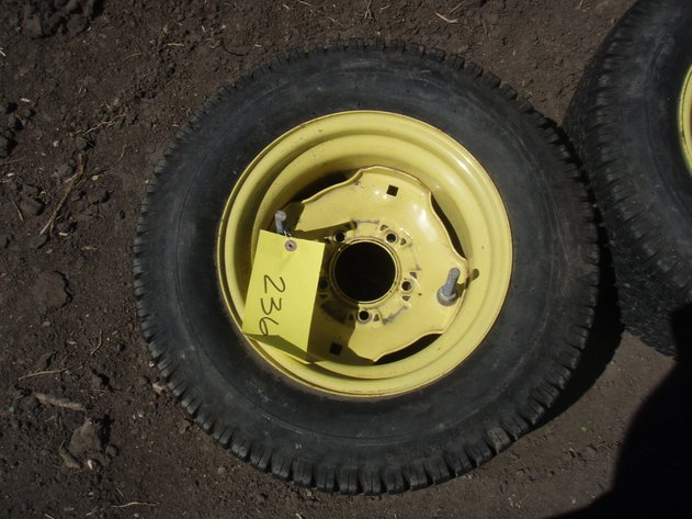 Image for John Deere 318 rear rims and tires 23x10.50x12