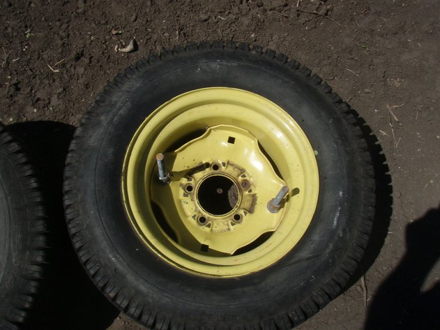 Image for John Deere 318 rear rims and tires 23x10.50x12