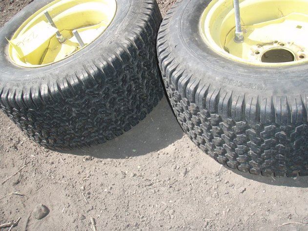 Image for John Deere 318 rear rims and tires 23x10.50x12