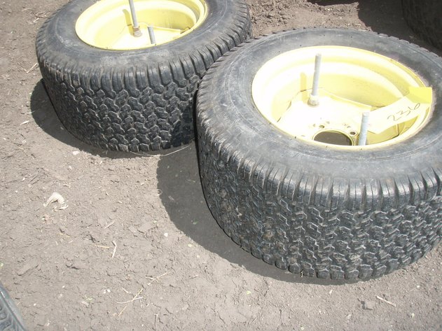 Image for John Deere 318 rear rims and tires 23x10.50x12