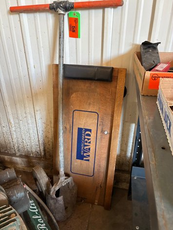 Image for Montgomery Ward wood shop creeper and post hole digger