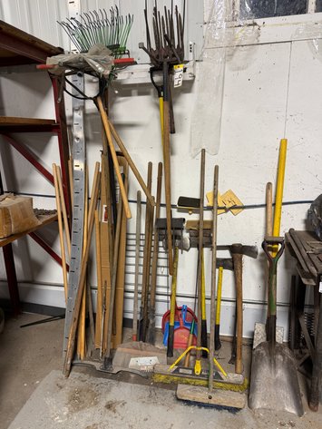 Image for Assorted Shovels, Rakes, Sledge Hammers, Pitchforks hanging on wall