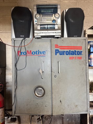 Image for Purolator cabinet, new oil filters, and aiwa radio