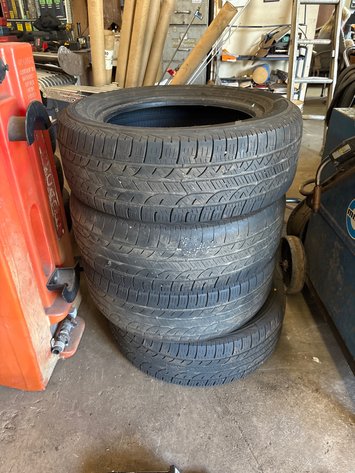 Image for (4) used 235/60r17 tires and (2) hitches for