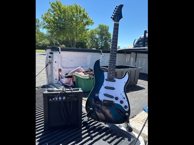 Image for Electric guitar with stand and amplifer