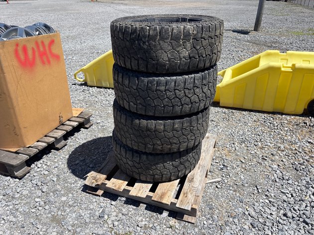 Image for E1. (4) used 33x 12.5 r 20 tires on wheels
