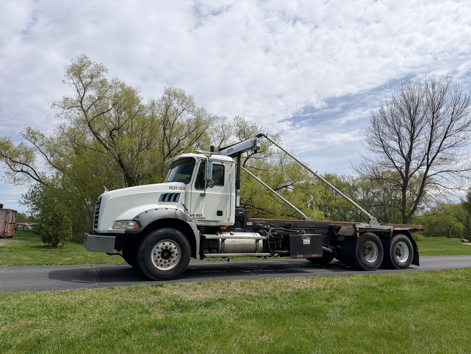 (3) Roll Off Trucks, Dumpsters, & Heavy Equipment