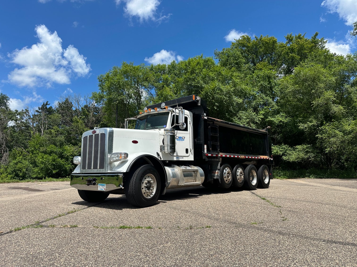 Heavy Equipment Auction: Peterbilt Dump Trucks, Racking, Attachments & More (141937)