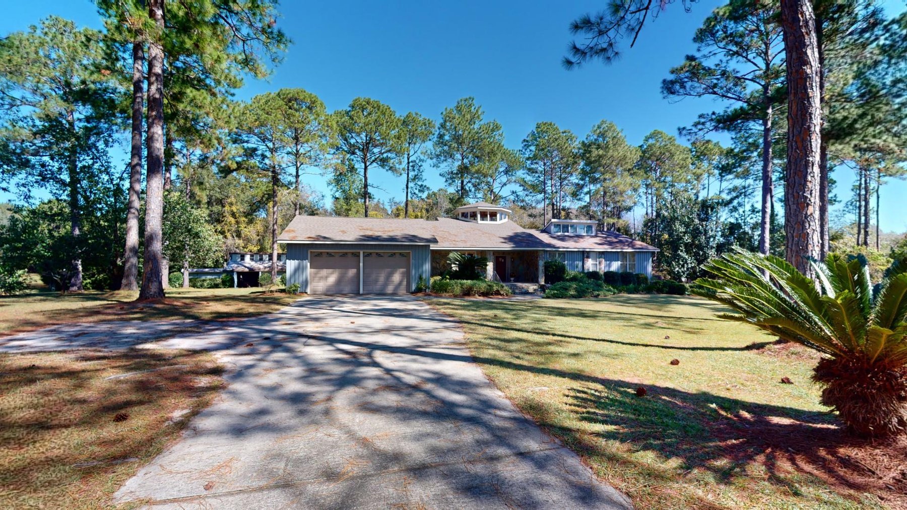 Image for Carolyn A. Peace Living Estate - Beautiful Stone-Faced Wood-Siding Ranch-Style Home