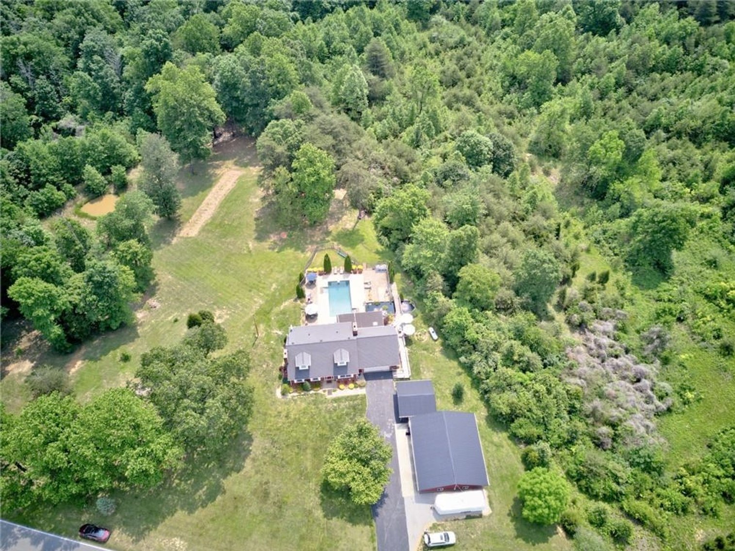 Image for Harrison County Real Estate Auction,  Cape Cod on 9.87 Acres, Inground Pool, Koi Pond & Finished Walkout - ONLINE AUCTION ONLY