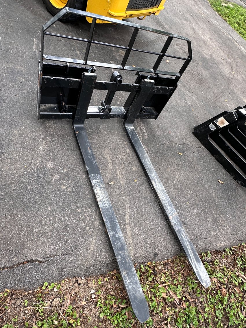 Image for New Holland Skid Loader and Attachments