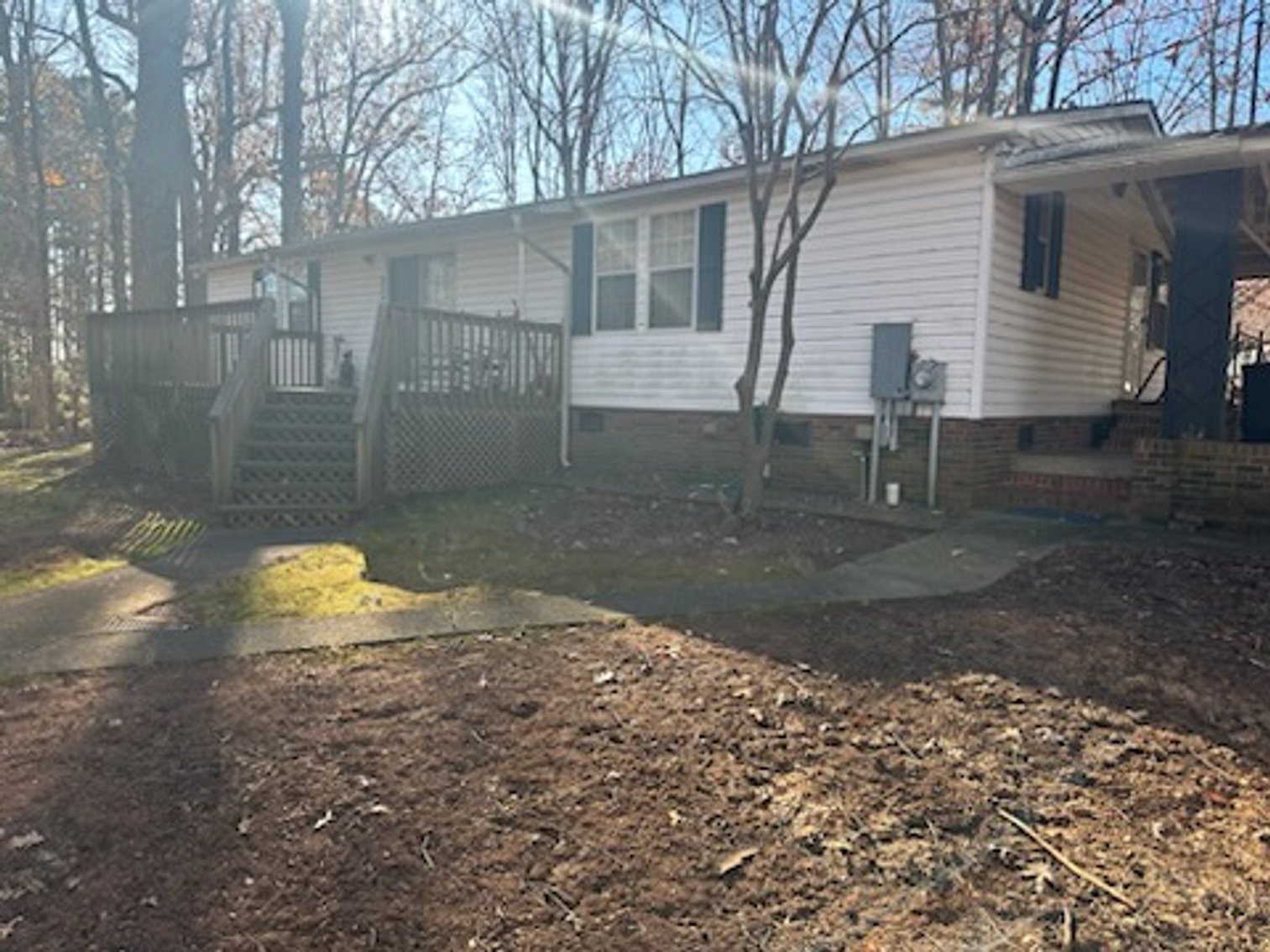 Troutman Home with 2+/- Acres and Multiple Out Buildings Auction