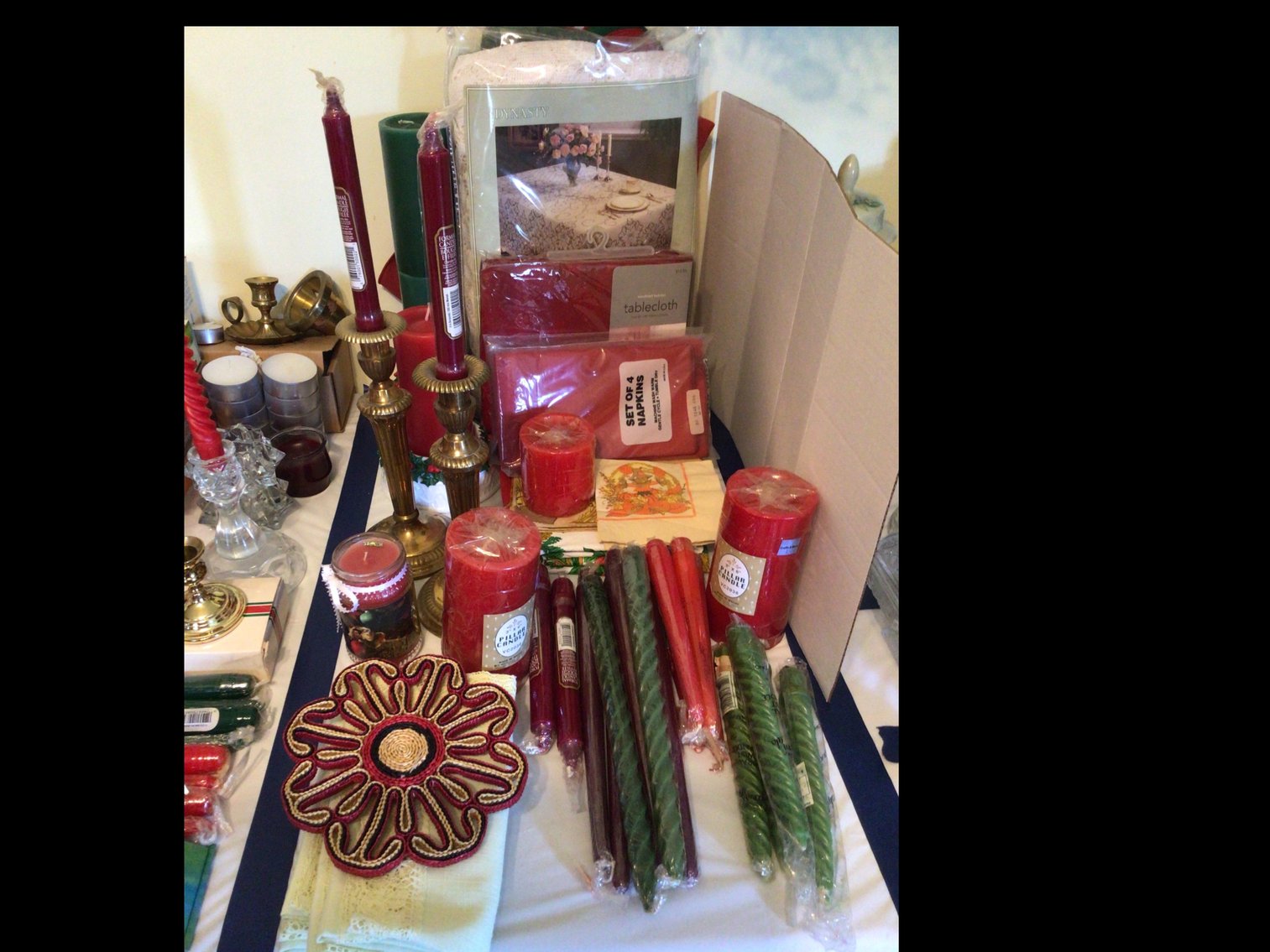 Image for Assortment of table cloths, napkins (new in packages) candles and candle holders