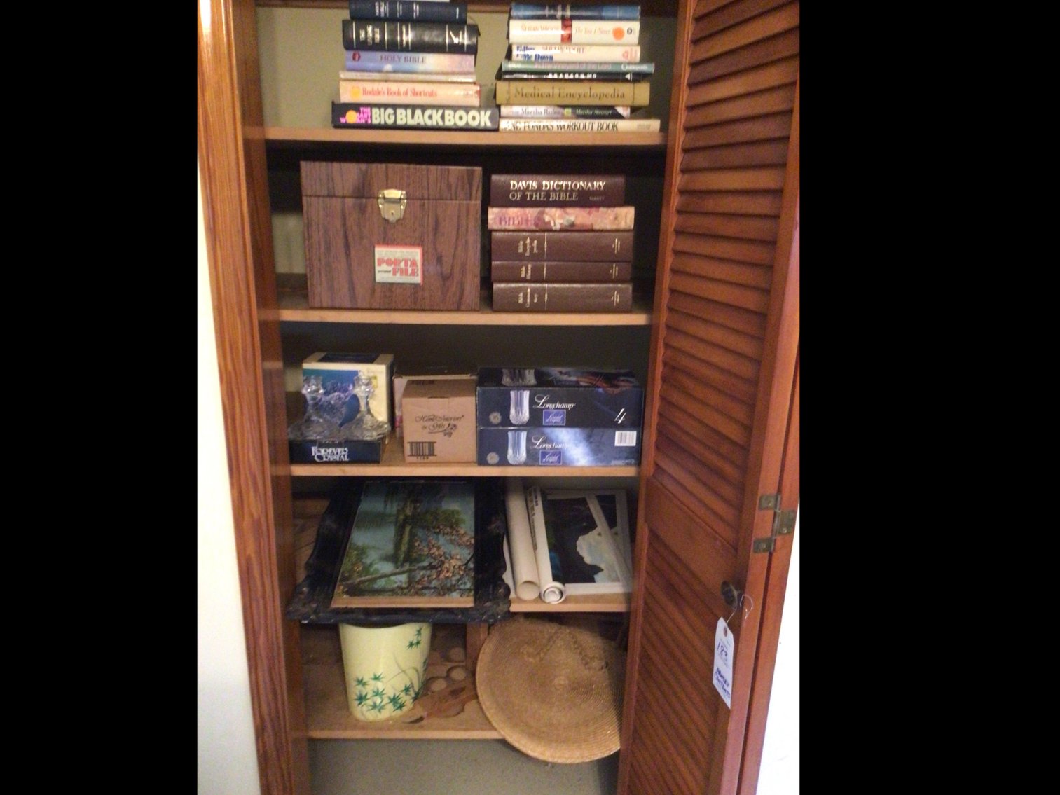 Image for Assortment of home decor such as crystal and home interior and miscellaneous books