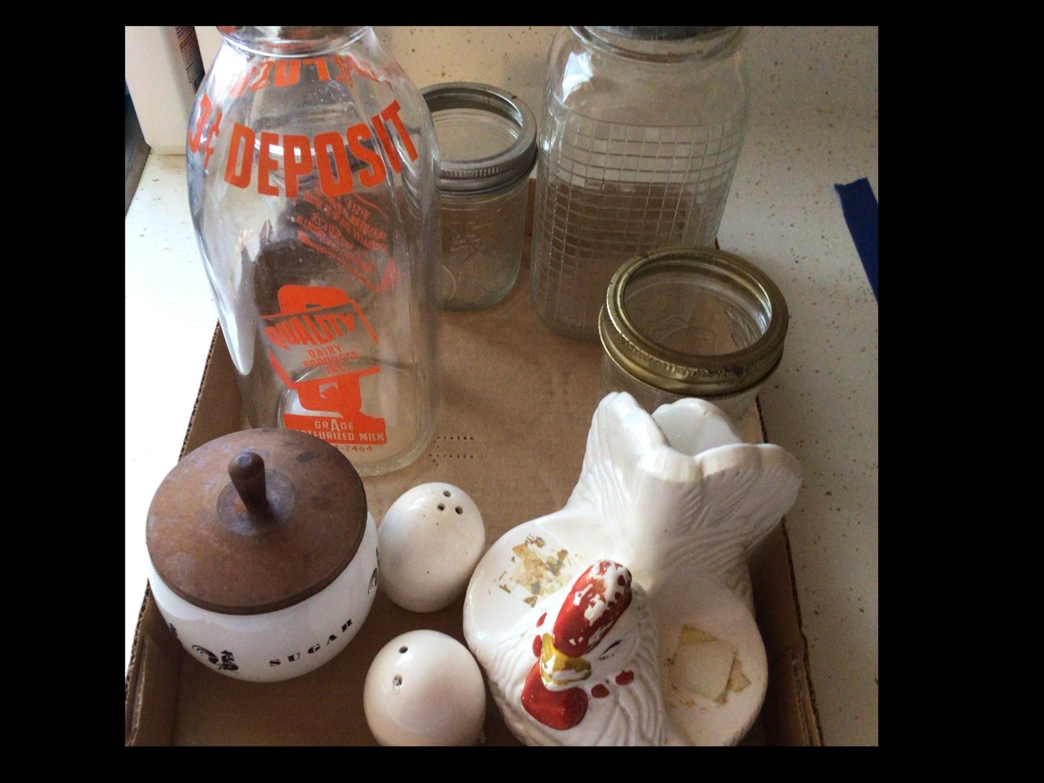 Image for Milk bottle with assortment of jars and sugar bowl