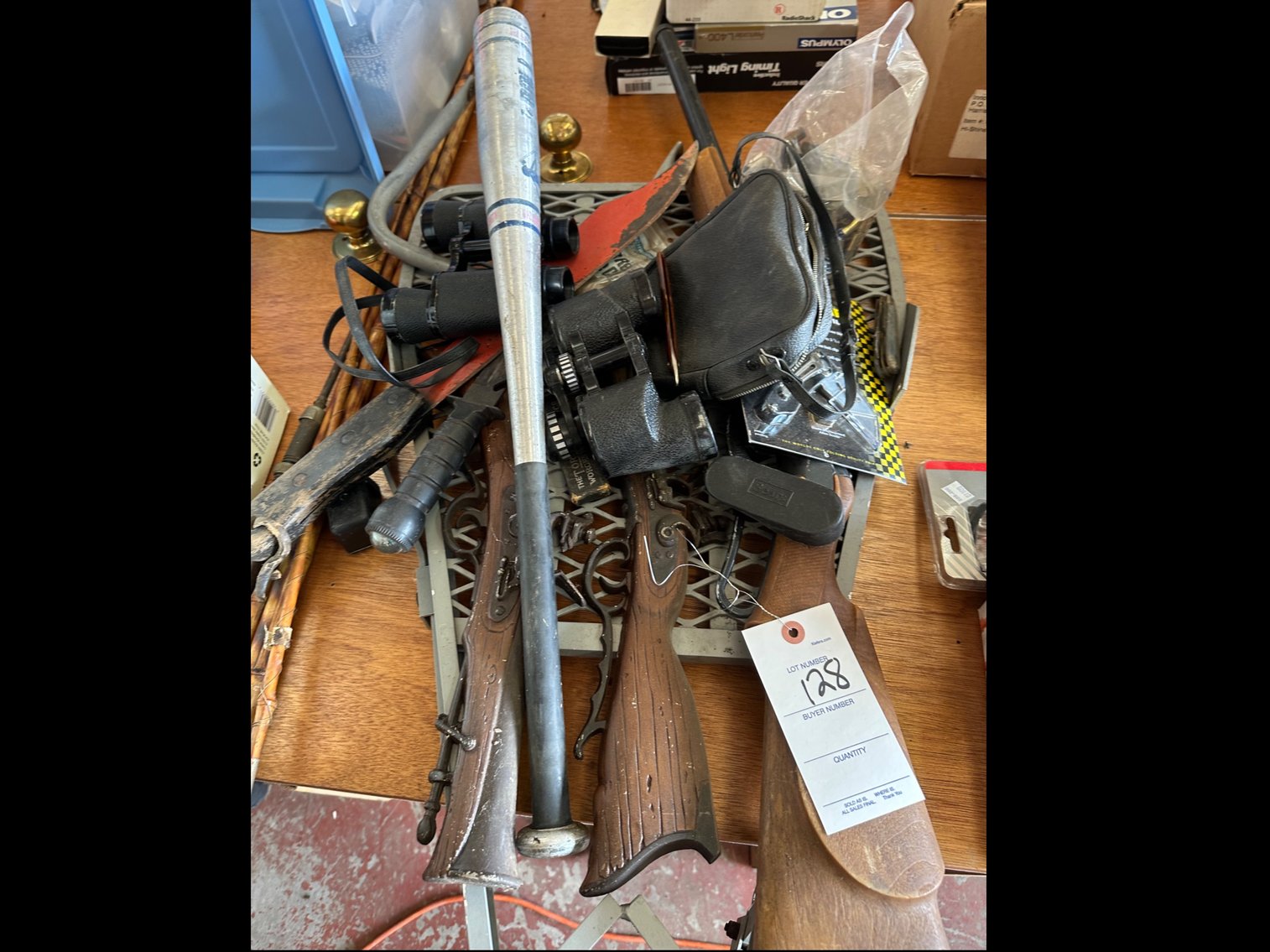 Image for Miscellaneous toys, a deerstand, machetes and binoculars