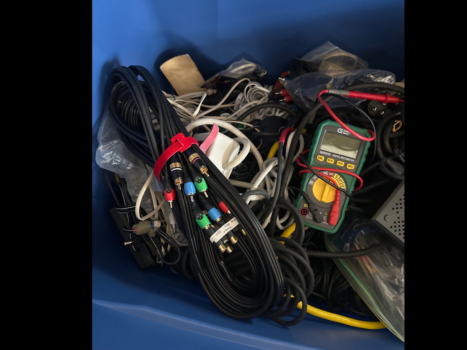 Image for Tub of miscellaneous items, digital multimeter, and power cords
