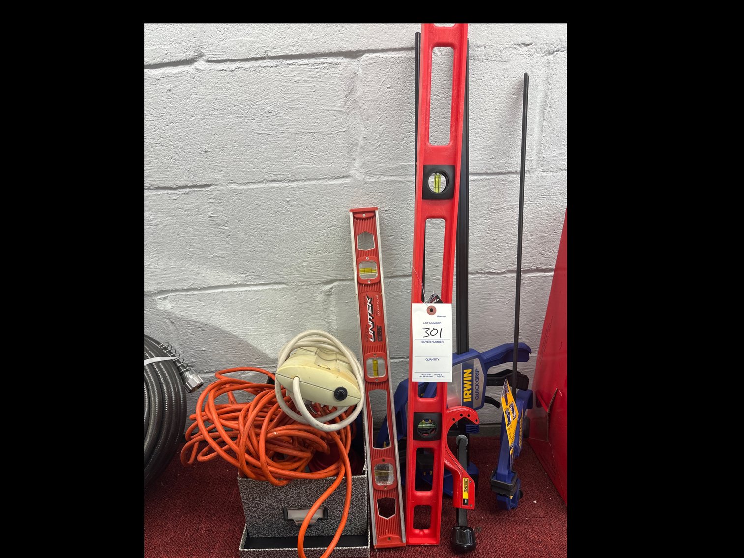 Image for Various tools levels, clamps, and extension cords