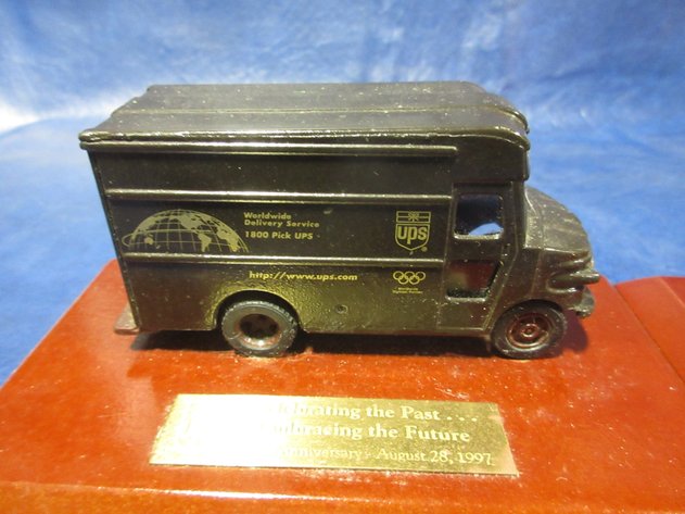 Image for UPS 1997 die cast Brown trucks on wood awards