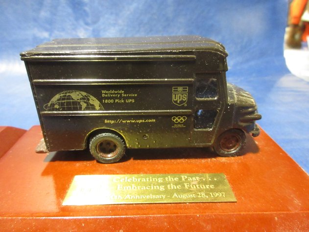 Image for UPS 1997 die cast Brown trucks on wood awards