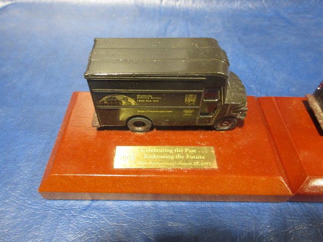 Image for UPS 1997 die cast Brown trucks on wood awards