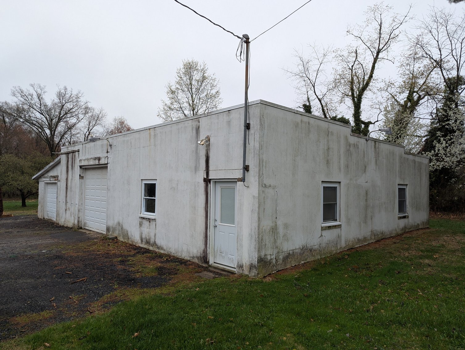 Image for 2-STORY OFFICE BLDG., 62'X40' BLOCK-FRAME SHOP, 40'X24' 3-BAY GARAGE FORMER BLEVINS HEATING & COOLING