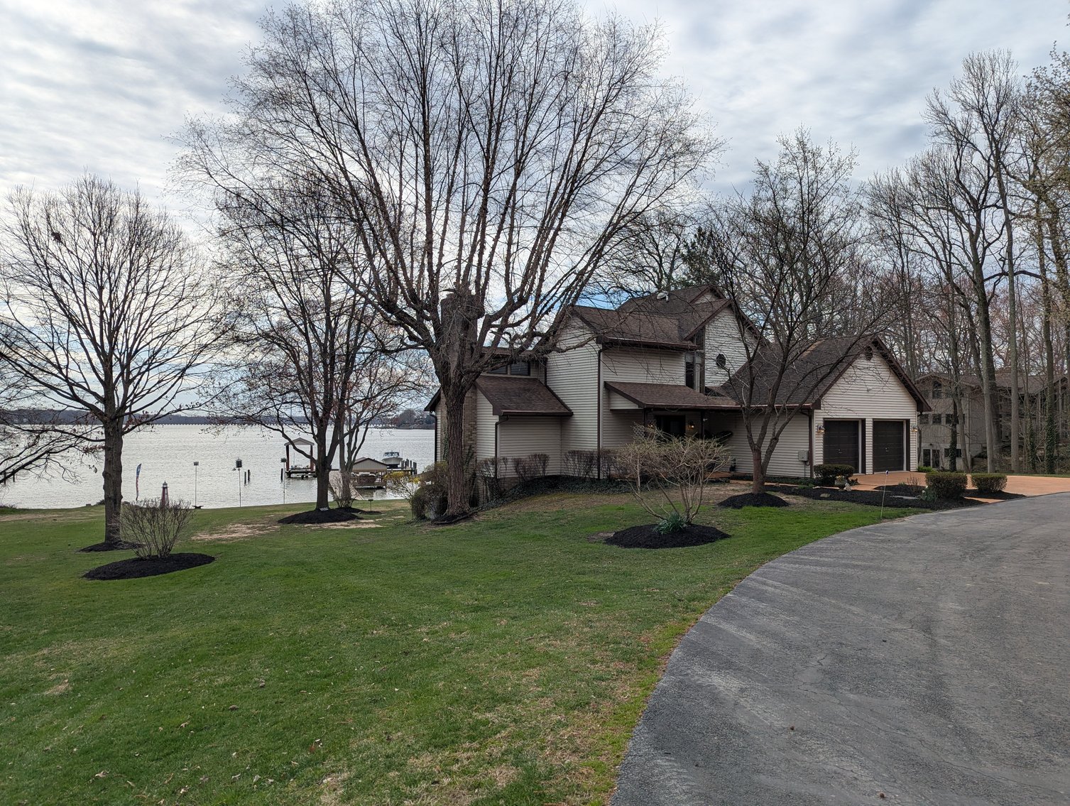 Image for LARGE WATERFRONT PROPERTY/ 2-STORY CONTEMP. HOME W/ ATT. 2-CAR GARAGE & 1-BR COTTAGE HOME/(4) PARCELS TOTALING 3.35 +/- AC SOLD IN THE ENTIRETY/ 155' FT FRONTAGE ON BUSH RIVER W SANDY BEACH/ LARGE DOCK W/ (10) +/- BOAT SLIPS, TIKI BAR & MORE!