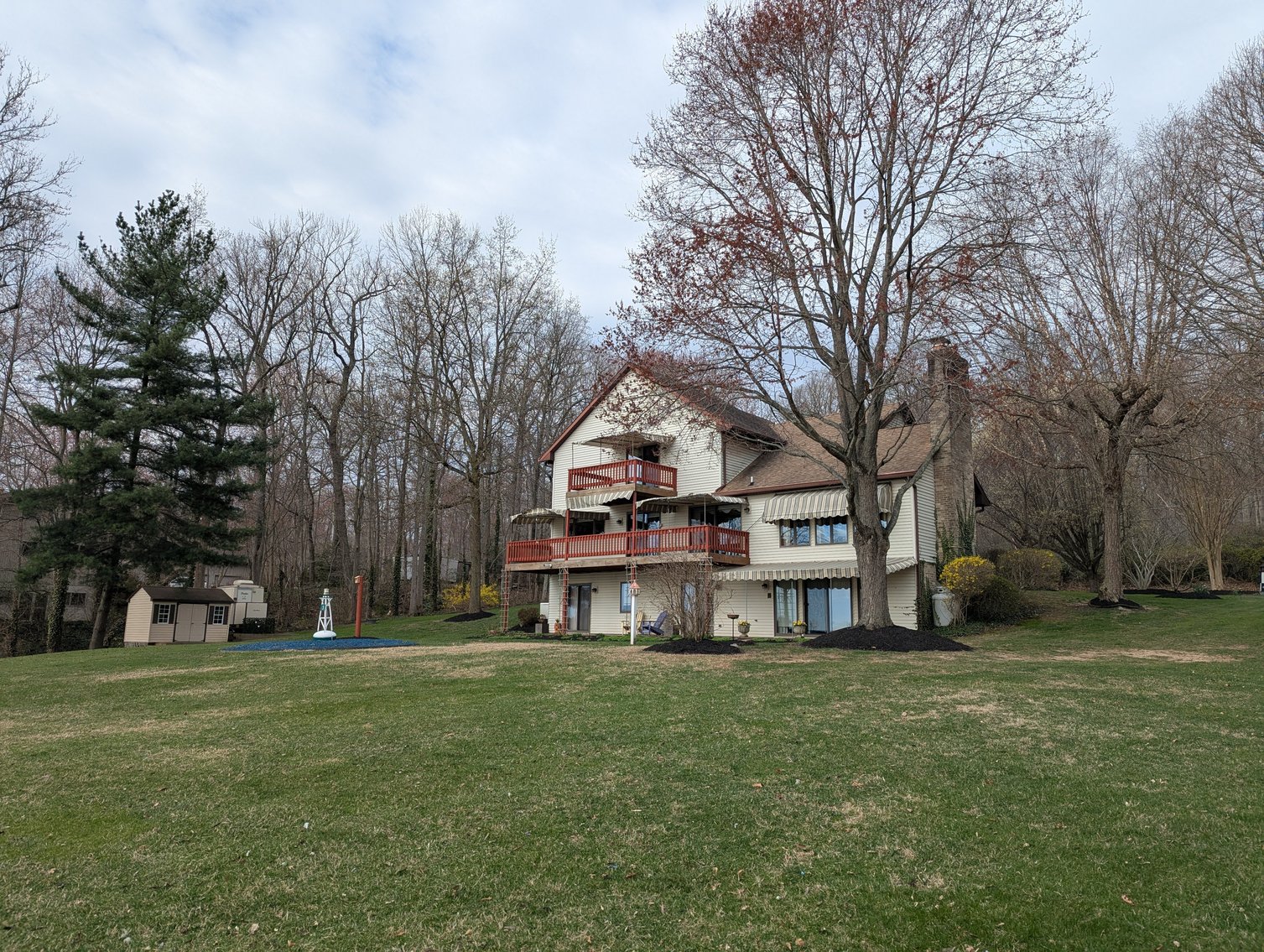 Image for LARGE WATERFRONT PROPERTY/ 2-STORY CONTEMP. HOME W/ ATT. 2-CAR GARAGE & 1-BR COTTAGE HOME/(4) PARCELS TOTALING 3.35 +/- AC SOLD IN THE ENTIRETY/ 155' FT FRONTAGE ON BUSH RIVER W SANDY BEACH/ LARGE DOCK W/ (10) +/- BOAT SLIPS, TIKI BAR & MORE!