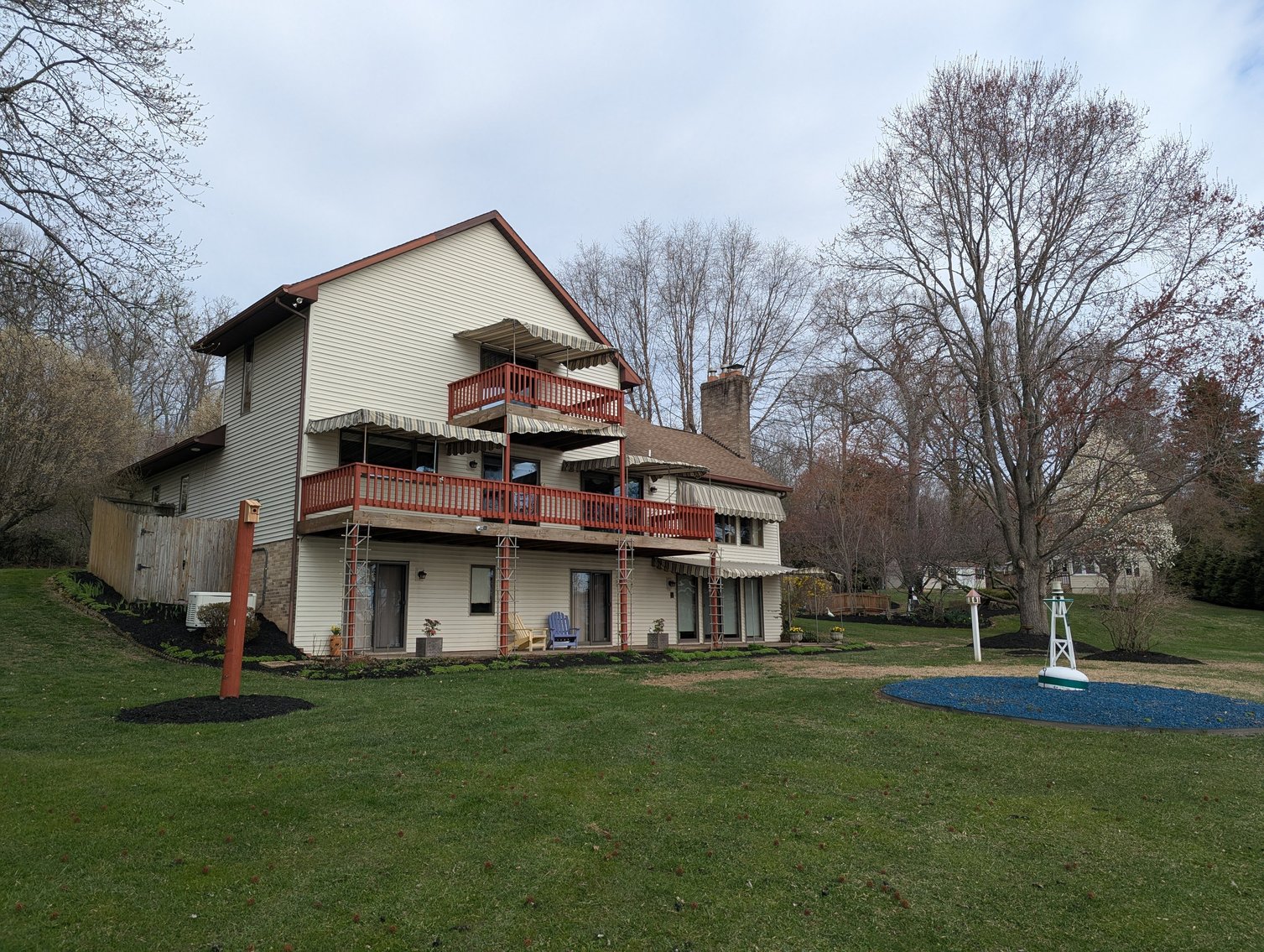 Image for LARGE WATERFRONT PROPERTY/ 2-STORY CONTEMP. HOME W/ ATT. 2-CAR GARAGE & 1-BR COTTAGE HOME/(4) PARCELS TOTALING 3.35 +/- AC SOLD IN THE ENTIRETY/ 155' FT FRONTAGE ON BUSH RIVER W SANDY BEACH/ LARGE DOCK W/ (10) +/- BOAT SLIPS, TIKI BAR & MORE!