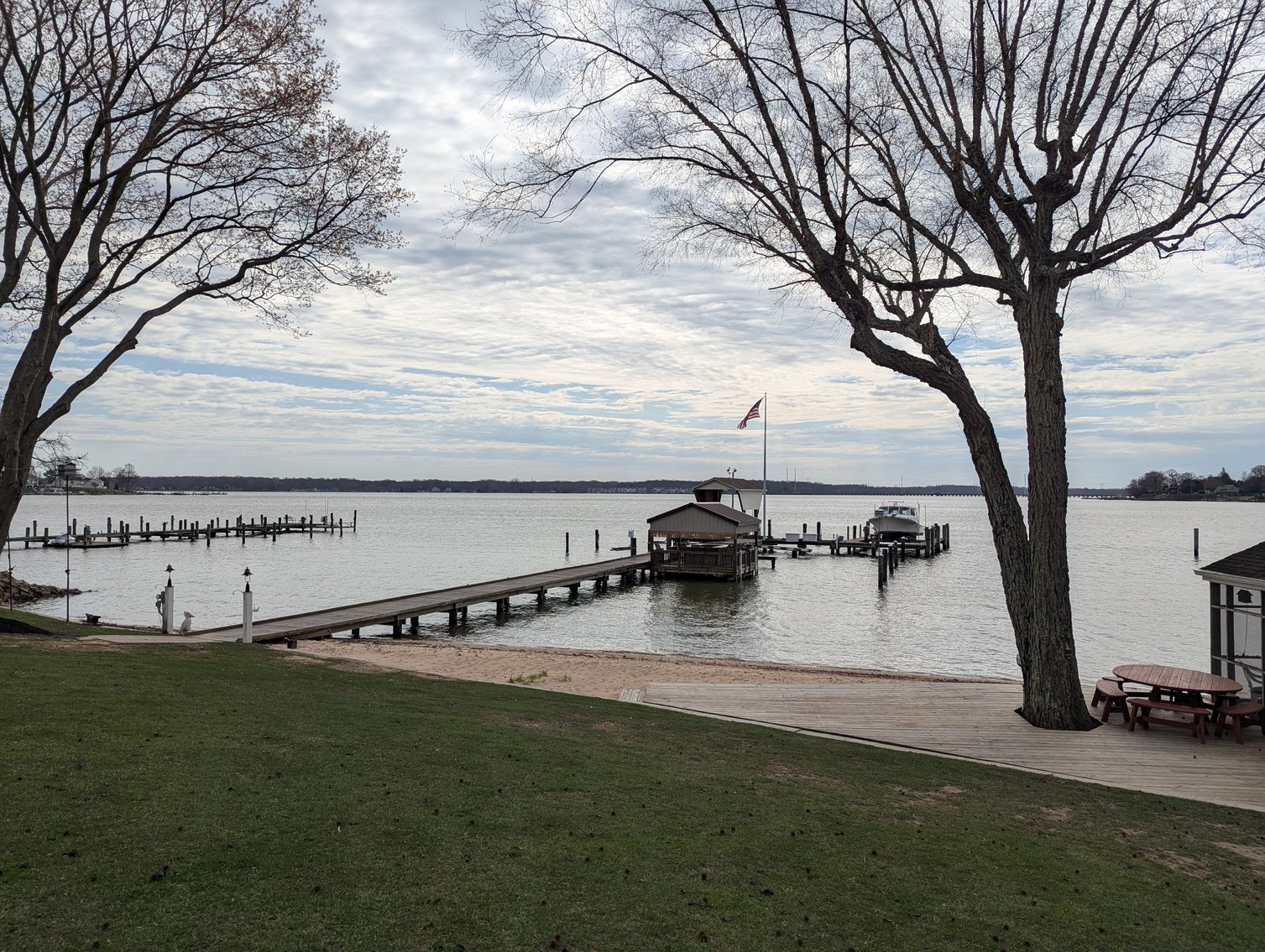 Image for LARGE WATERFRONT PROPERTY/ 2-STORY CONTEMP. HOME W/ ATT. 2-CAR GARAGE & 1-BR COTTAGE HOME/(4) PARCELS TOTALING 3.35 +/- AC SOLD IN THE ENTIRETY/ 155' FT FRONTAGE ON BUSH RIVER W SANDY BEACH/ LARGE DOCK W/ (10) +/- BOAT SLIPS, TIKI BAR & MORE!