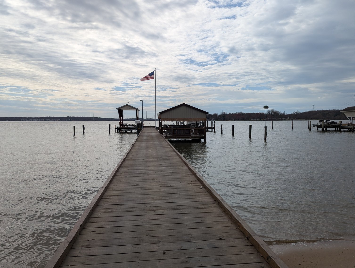 Image for LARGE WATERFRONT PROPERTY/ 2-STORY CONTEMP. HOME W/ ATT. 2-CAR GARAGE & 1-BR COTTAGE HOME/(4) PARCELS TOTALING 3.35 +/- AC SOLD IN THE ENTIRETY/ 155' FT FRONTAGE ON BUSH RIVER W SANDY BEACH/ LARGE DOCK W/ (10) +/- BOAT SLIPS, TIKI BAR & MORE!