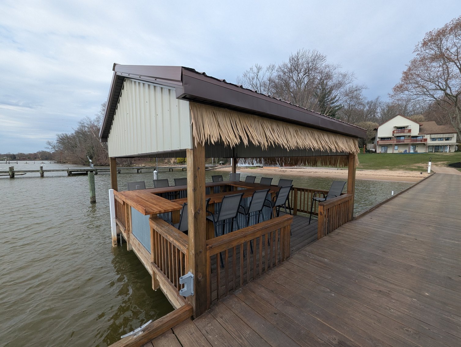Image for LARGE WATERFRONT PROPERTY/ 2-STORY CONTEMP. HOME W/ ATT. 2-CAR GARAGE & 1-BR COTTAGE HOME/(4) PARCELS TOTALING 3.35 +/- AC SOLD IN THE ENTIRETY/ 155' FT FRONTAGE ON BUSH RIVER W SANDY BEACH/ LARGE DOCK W/ (10) +/- BOAT SLIPS, TIKI BAR & MORE!