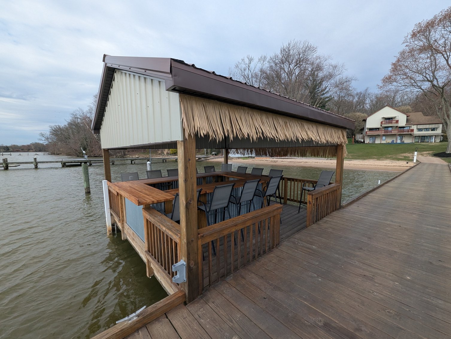 Image for LARGE WATERFRONT PROPERTY/ 2-STORY CONTEMP. HOME W/ ATT. 2-CAR GARAGE & 1-BR COTTAGE HOME/(4) PARCELS TOTALING 3.35 +/- AC SOLD IN THE ENTIRETY/ 155' FT FRONTAGE ON BUSH RIVER W SANDY BEACH/ LARGE DOCK W/ (10) +/- BOAT SLIPS, TIKI BAR & MORE!