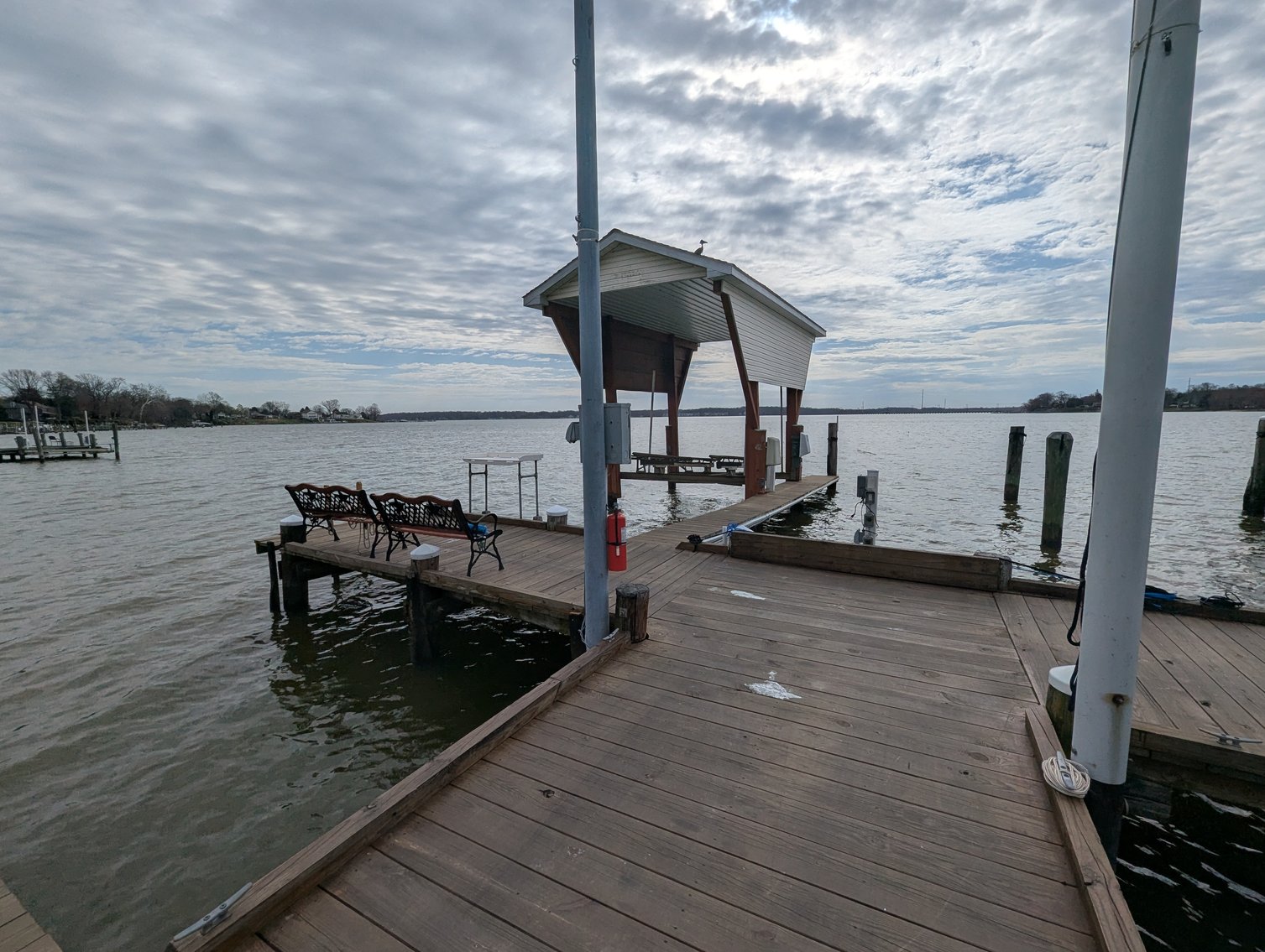 Image for LARGE WATERFRONT PROPERTY/ 2-STORY CONTEMP. HOME W/ ATT. 2-CAR GARAGE & 1-BR COTTAGE HOME/(4) PARCELS TOTALING 3.35 +/- AC SOLD IN THE ENTIRETY/ 155' FT FRONTAGE ON BUSH RIVER W SANDY BEACH/ LARGE DOCK W/ (10) +/- BOAT SLIPS, TIKI BAR & MORE!