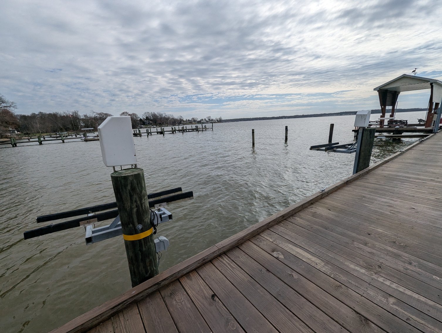Image for LARGE WATERFRONT PROPERTY/ 2-STORY CONTEMP. HOME W/ ATT. 2-CAR GARAGE & 1-BR COTTAGE HOME/(4) PARCELS TOTALING 3.35 +/- AC SOLD IN THE ENTIRETY/ 155' FT FRONTAGE ON BUSH RIVER W SANDY BEACH/ LARGE DOCK W/ (10) +/- BOAT SLIPS, TIKI BAR & MORE!