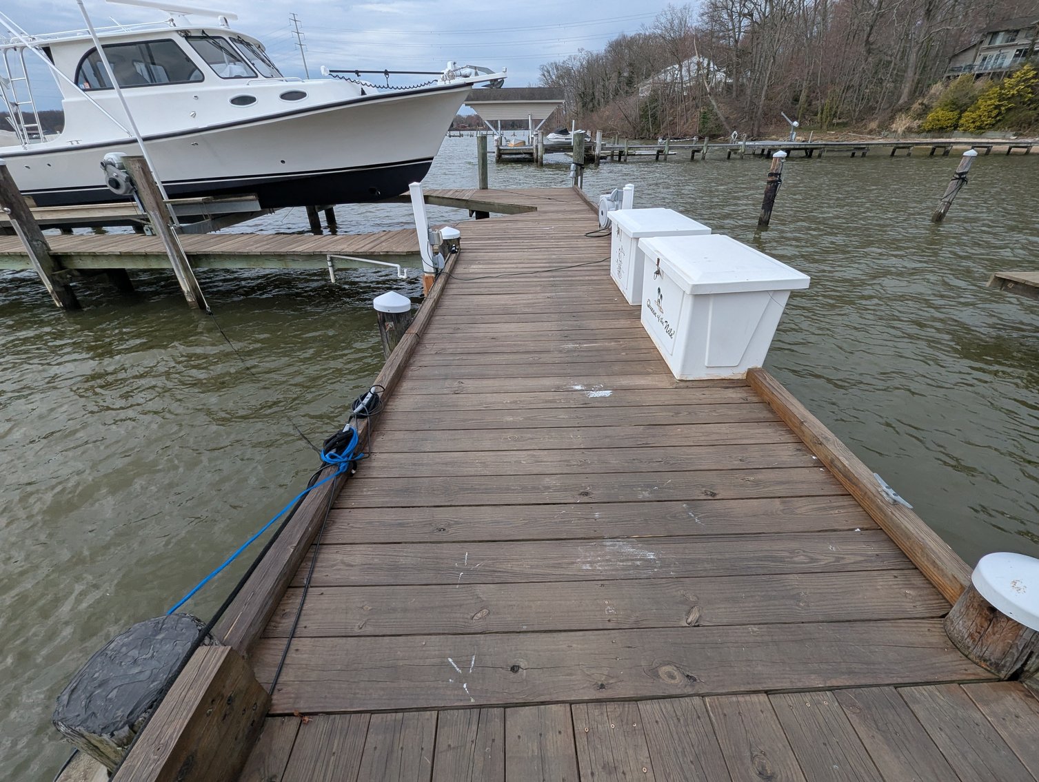 Image for LARGE WATERFRONT PROPERTY/ 2-STORY CONTEMP. HOME W/ ATT. 2-CAR GARAGE & 1-BR COTTAGE HOME/(4) PARCELS TOTALING 3.35 +/- AC SOLD IN THE ENTIRETY/ 155' FT FRONTAGE ON BUSH RIVER W SANDY BEACH/ LARGE DOCK W/ (10) +/- BOAT SLIPS, TIKI BAR & MORE!