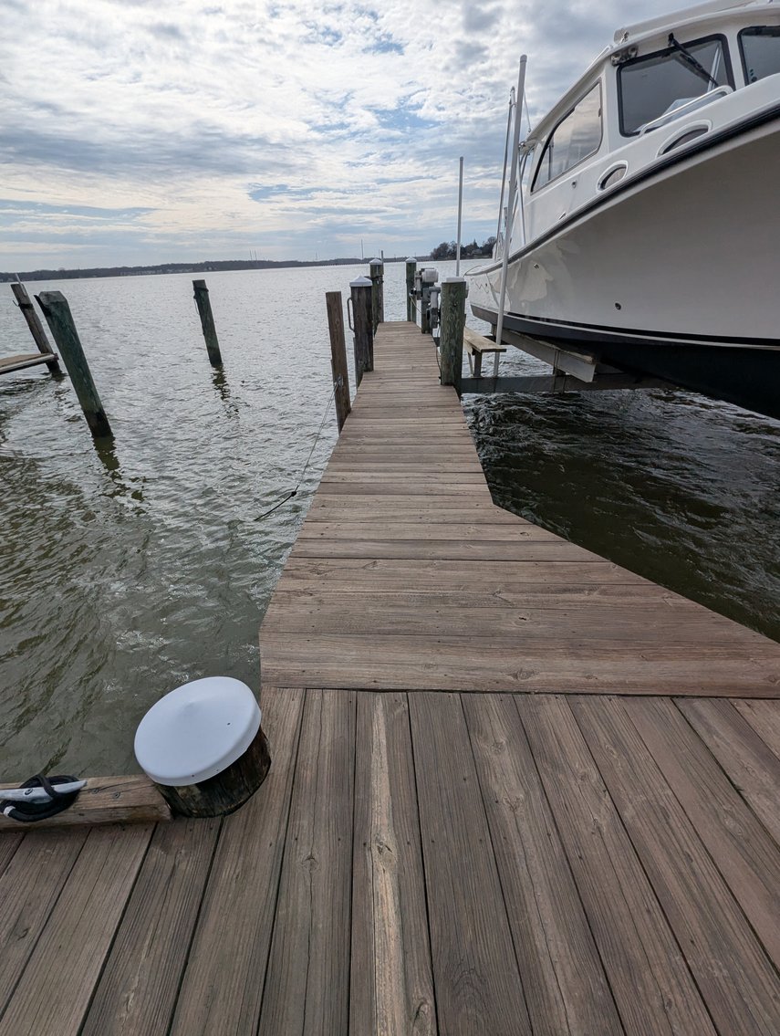 Image for LARGE WATERFRONT PROPERTY/ 2-STORY CONTEMP. HOME W/ ATT. 2-CAR GARAGE & 1-BR COTTAGE HOME/(4) PARCELS TOTALING 3.35 +/- AC SOLD IN THE ENTIRETY/ 155' FT FRONTAGE ON BUSH RIVER W SANDY BEACH/ LARGE DOCK W/ (10) +/- BOAT SLIPS, TIKI BAR & MORE!