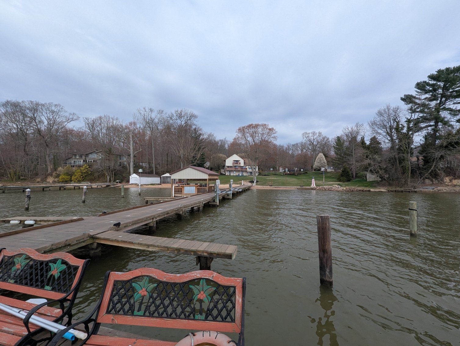 Image for LARGE WATERFRONT PROPERTY/ 2-STORY CONTEMP. HOME W/ ATT. 2-CAR GARAGE & 1-BR COTTAGE HOME/(4) PARCELS TOTALING 3.35 +/- AC SOLD IN THE ENTIRETY/ 155' FT FRONTAGE ON BUSH RIVER W SANDY BEACH/ LARGE DOCK W/ (10) +/- BOAT SLIPS, TIKI BAR & MORE!