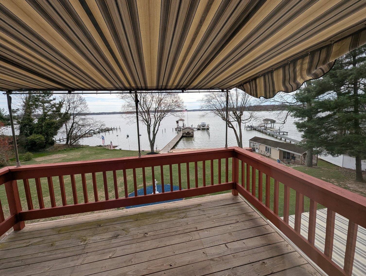 Image for LARGE WATERFRONT PROPERTY/ 2-STORY CONTEMP. HOME W/ ATT. 2-CAR GARAGE & 1-BR COTTAGE HOME/(4) PARCELS TOTALING 3.35 +/- AC SOLD IN THE ENTIRETY/ 155' FT FRONTAGE ON BUSH RIVER W SANDY BEACH/ LARGE DOCK W/ (10) +/- BOAT SLIPS, TIKI BAR & MORE!