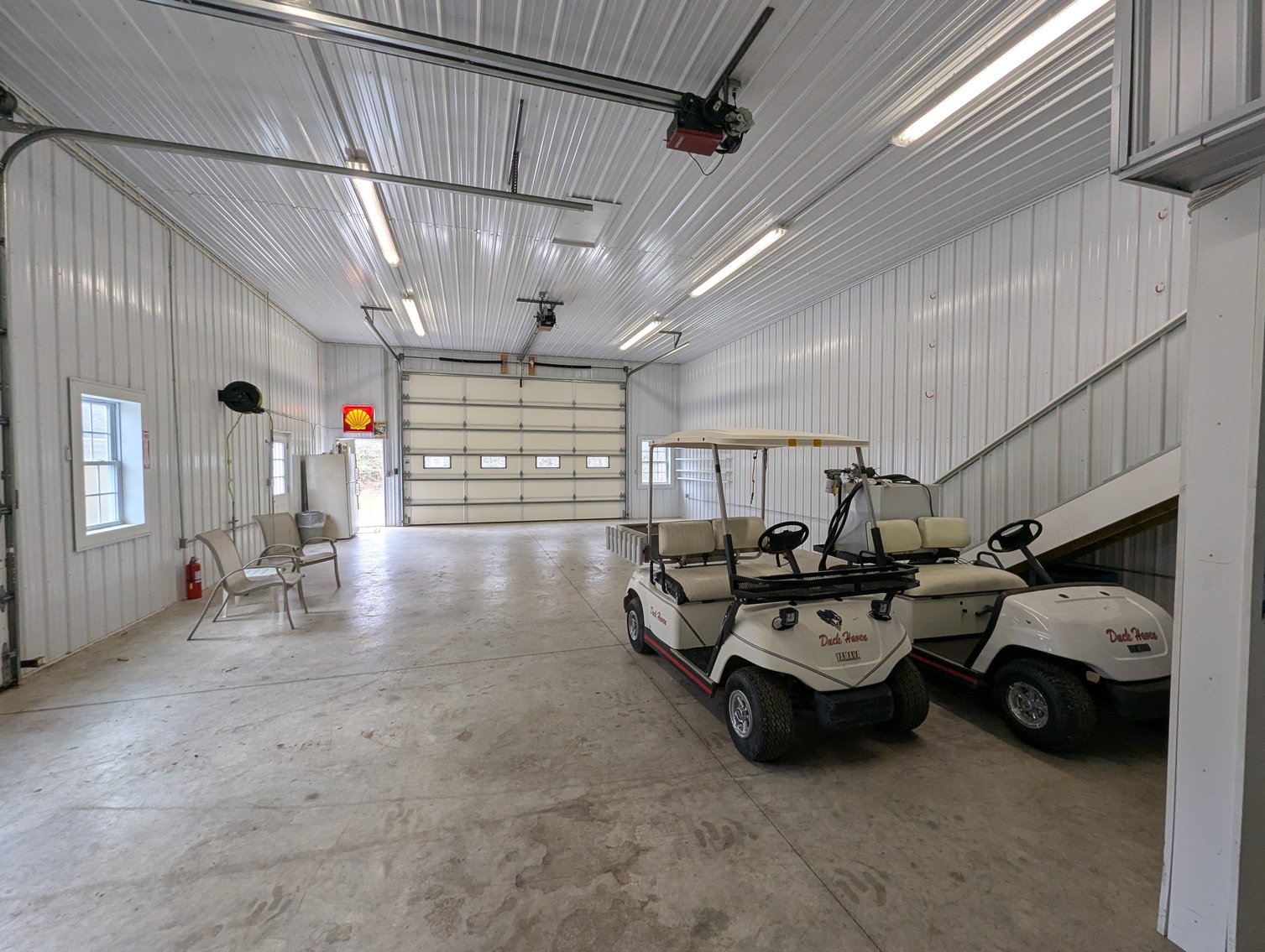 Image for LARGE WATERFRONT PROPERTY/ 2-STORY CONTEMP. HOME W/ ATT. 2-CAR GARAGE & 1-BR COTTAGE HOME/(4) PARCELS TOTALING 3.35 +/- AC SOLD IN THE ENTIRETY/ 155' FT FRONTAGE ON BUSH RIVER W SANDY BEACH/ LARGE DOCK W/ (10) +/- BOAT SLIPS, TIKI BAR & MORE!