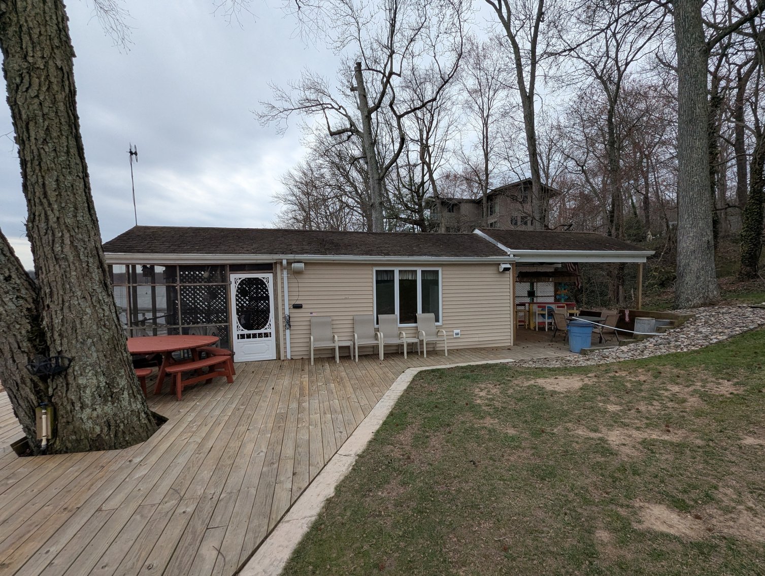 Image for LARGE WATERFRONT PROPERTY/ 2-STORY CONTEMP. HOME W/ ATT. 2-CAR GARAGE & 1-BR COTTAGE HOME/(4) PARCELS TOTALING 3.35 +/- AC SOLD IN THE ENTIRETY/ 155' FT FRONTAGE ON BUSH RIVER W SANDY BEACH/ LARGE DOCK W/ (10) +/- BOAT SLIPS, TIKI BAR & MORE!