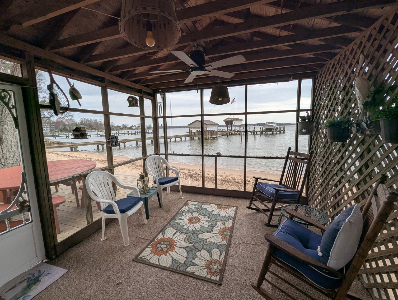 Image for LARGE WATERFRONT PROPERTY/ 2-STORY CONTEMP. HOME W/ ATT. 2-CAR GARAGE & 1-BR COTTAGE HOME/(4) PARCELS TOTALING 3.35 +/- AC SOLD IN THE ENTIRETY/ 155' FT FRONTAGE ON BUSH RIVER W SANDY BEACH/ LARGE DOCK W/ (10) +/- BOAT SLIPS, TIKI BAR & MORE!