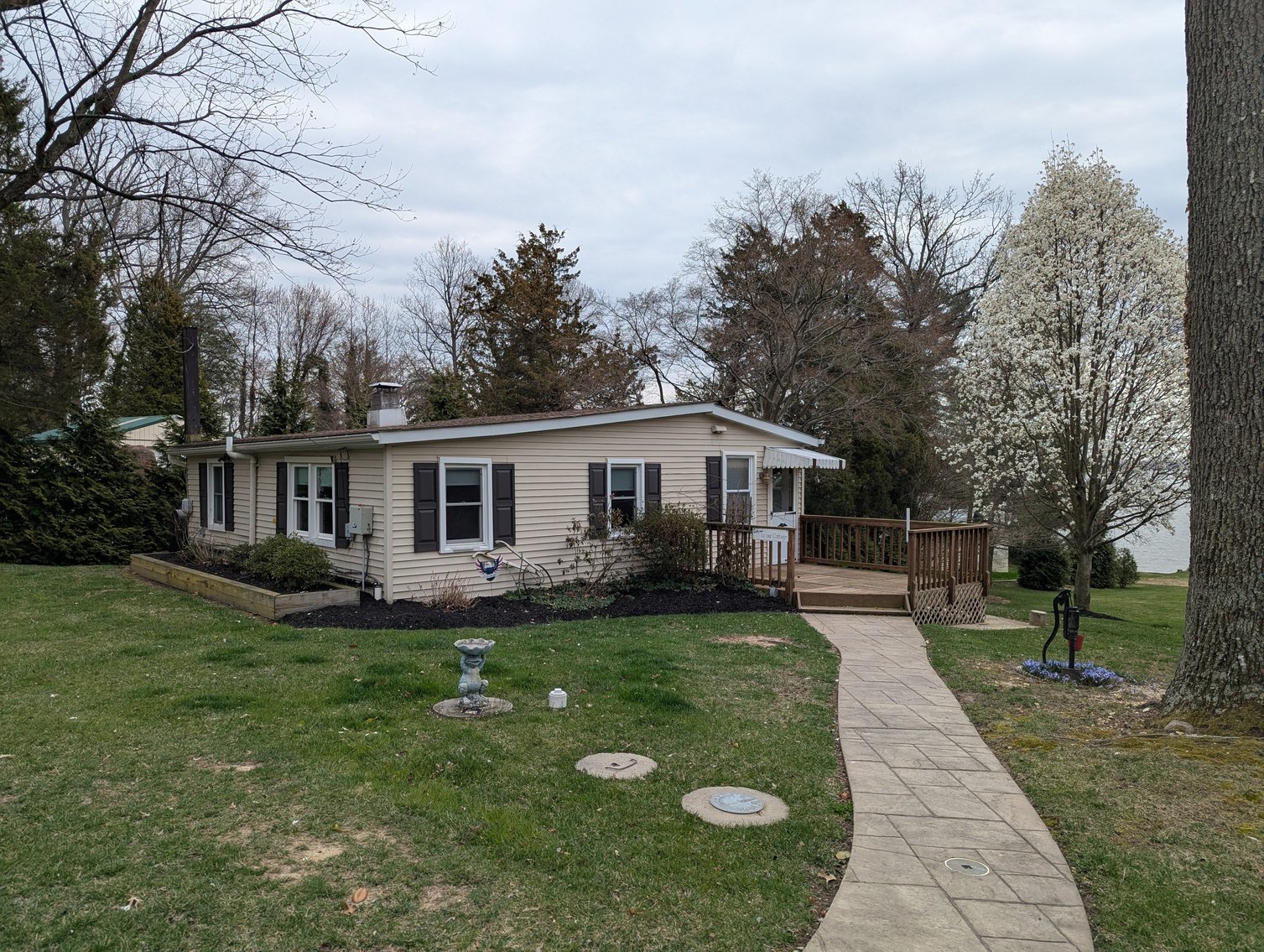 Image for LARGE WATERFRONT PROPERTY/ 2-STORY CONTEMP. HOME W/ ATT. 2-CAR GARAGE & 1-BR COTTAGE HOME/(4) PARCELS TOTALING 3.35 +/- AC SOLD IN THE ENTIRETY/ 155' FT FRONTAGE ON BUSH RIVER W SANDY BEACH/ LARGE DOCK W/ (10) +/- BOAT SLIPS, TIKI BAR & MORE!